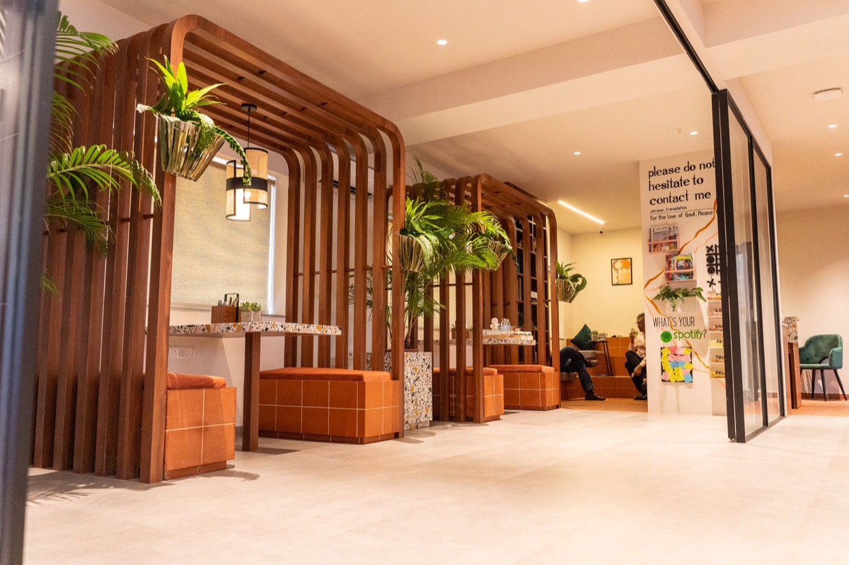 Wooden slat booths with terracotta seating in the lounge