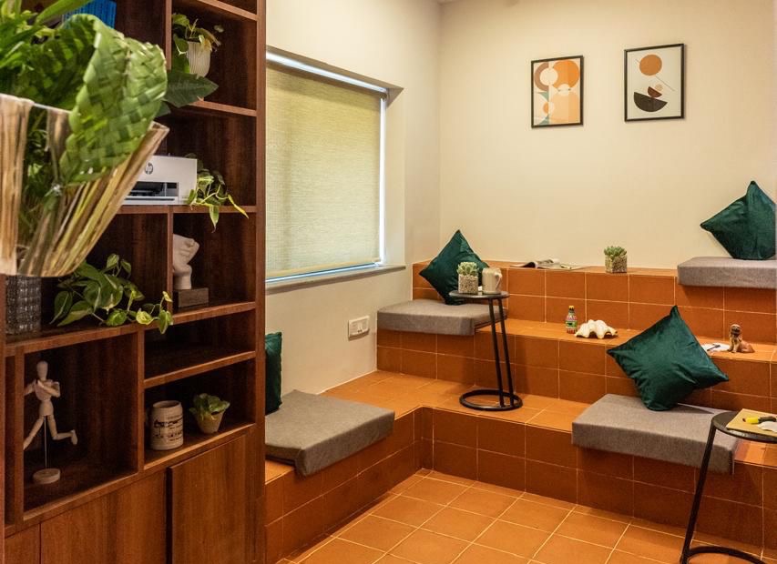 The quiet zone amphitheater, with stepped seating, cushions, and a bookshelf